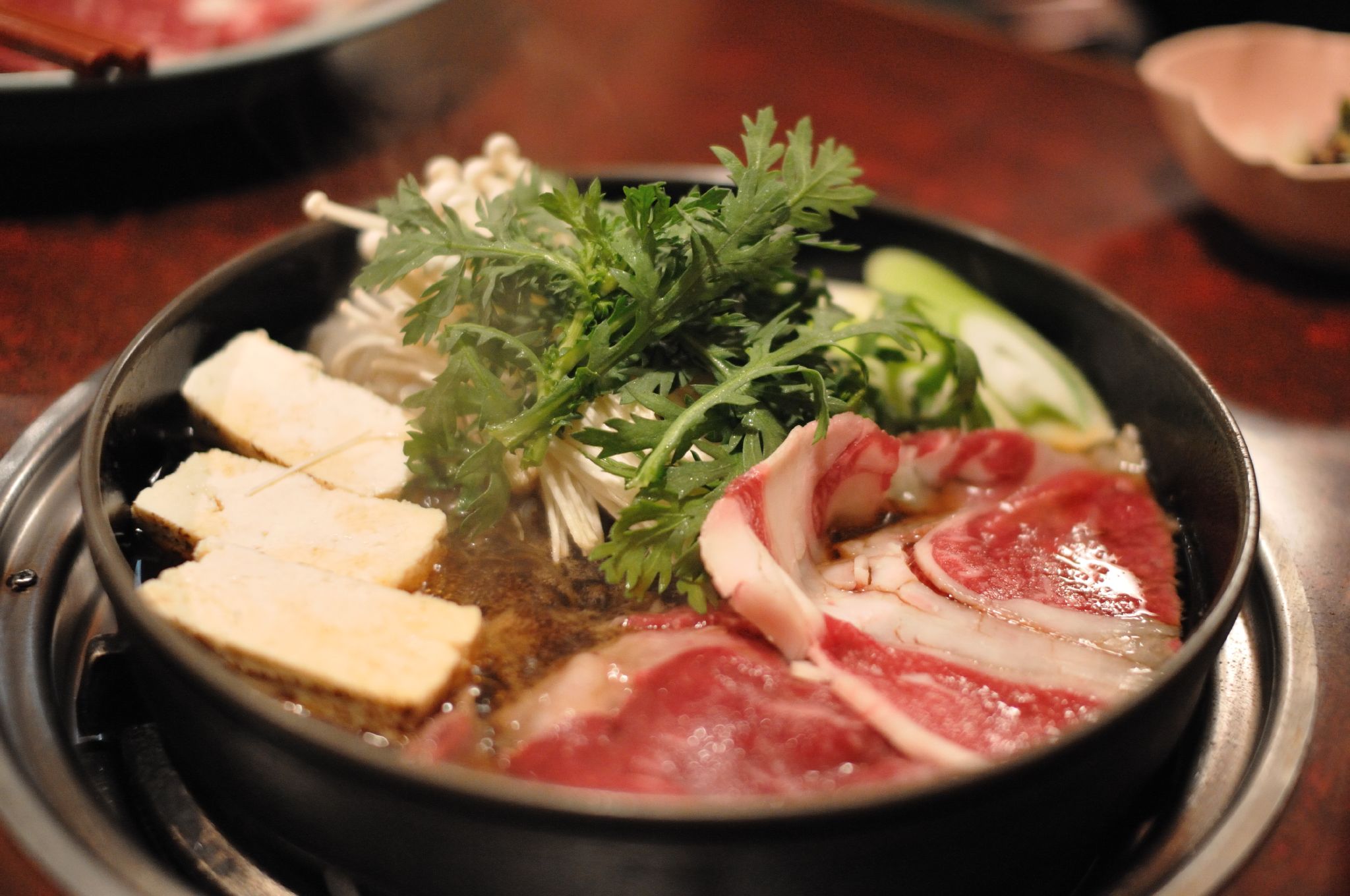 Japanese Sukiyaki with Beef, Tofu, Mushrooms, and Greens